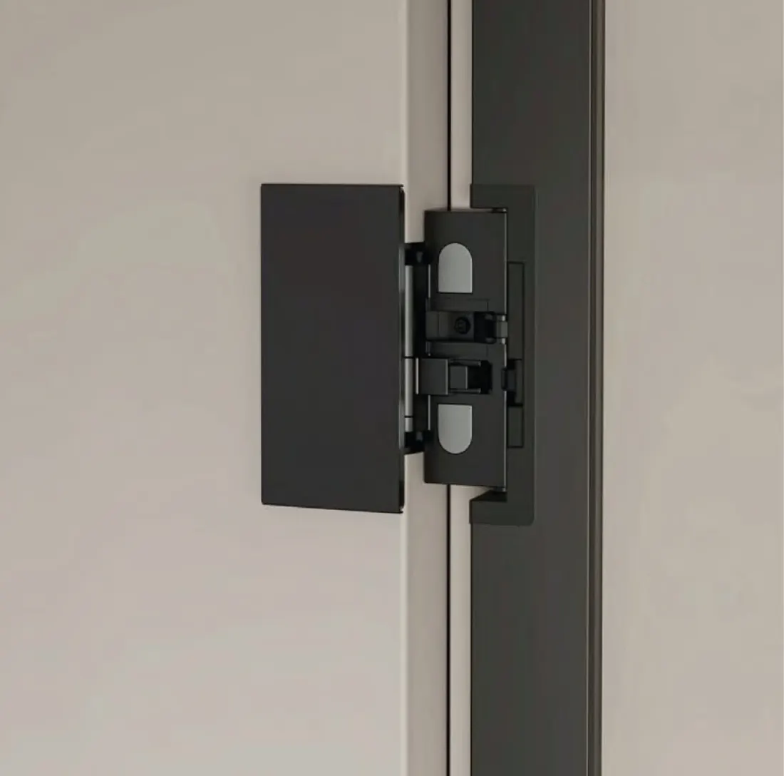 Concealed hinge fitted to a slim glass shutter profile